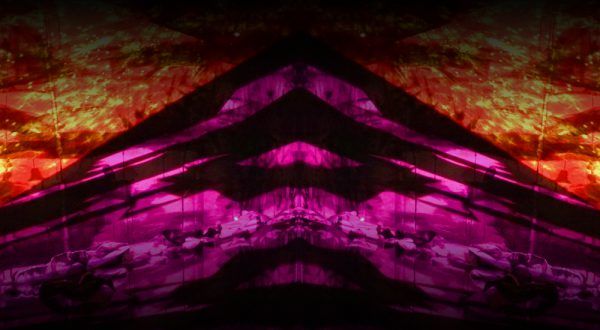Image of bright red and purple abstract projections.