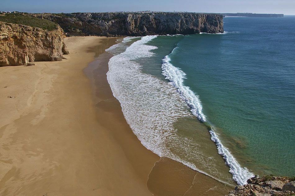 A picture of a beach with blue sea. 